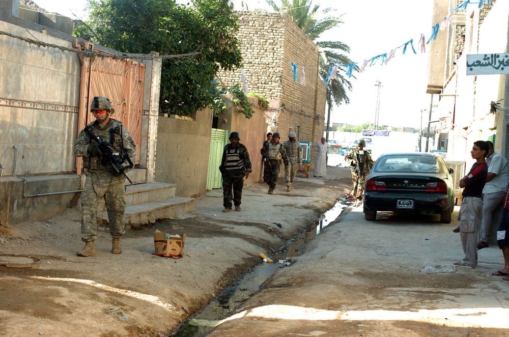 Strike Soldiers patrol through Baghdad neighborhood of Shula