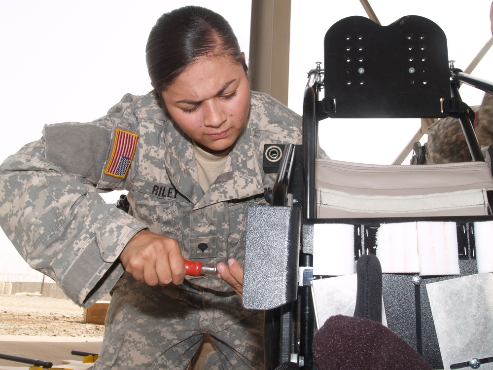 MPs, Civilian Donate Wheelchairs to Iraqi Children