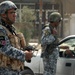 Iraqi National Police Monitor Traffic Checkpoint