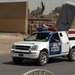 Iraqi National Police Monitor Traffic Checkpoint
