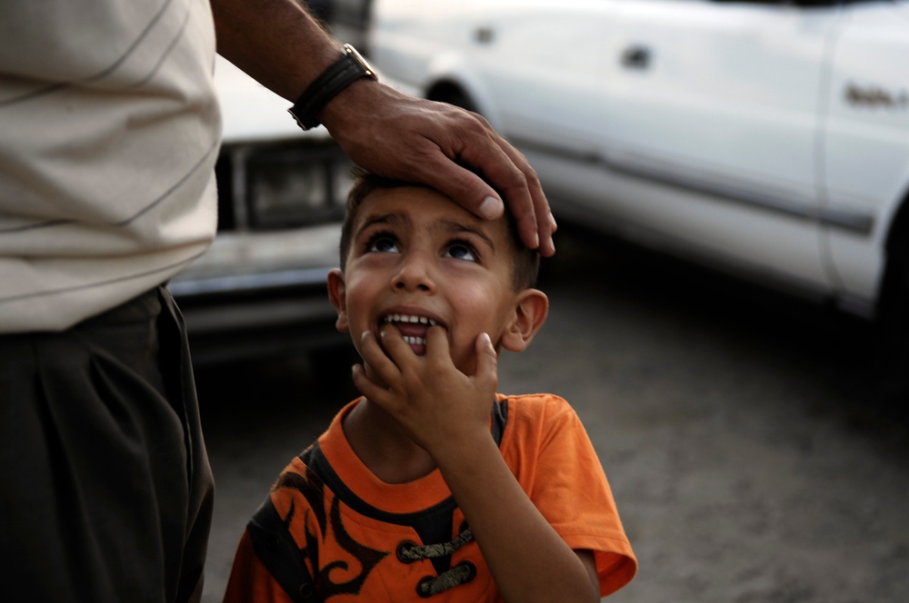 U.S. and Iraqi Soldiers Search Car Lot