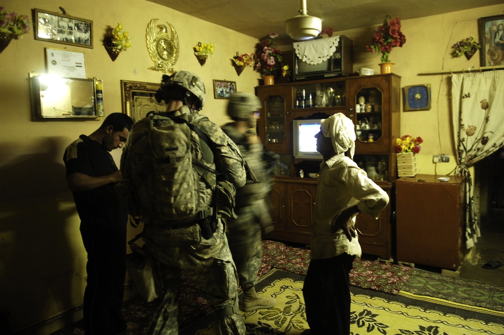 Iraqi and U.S. Soldiers Search for Weapons Cache
