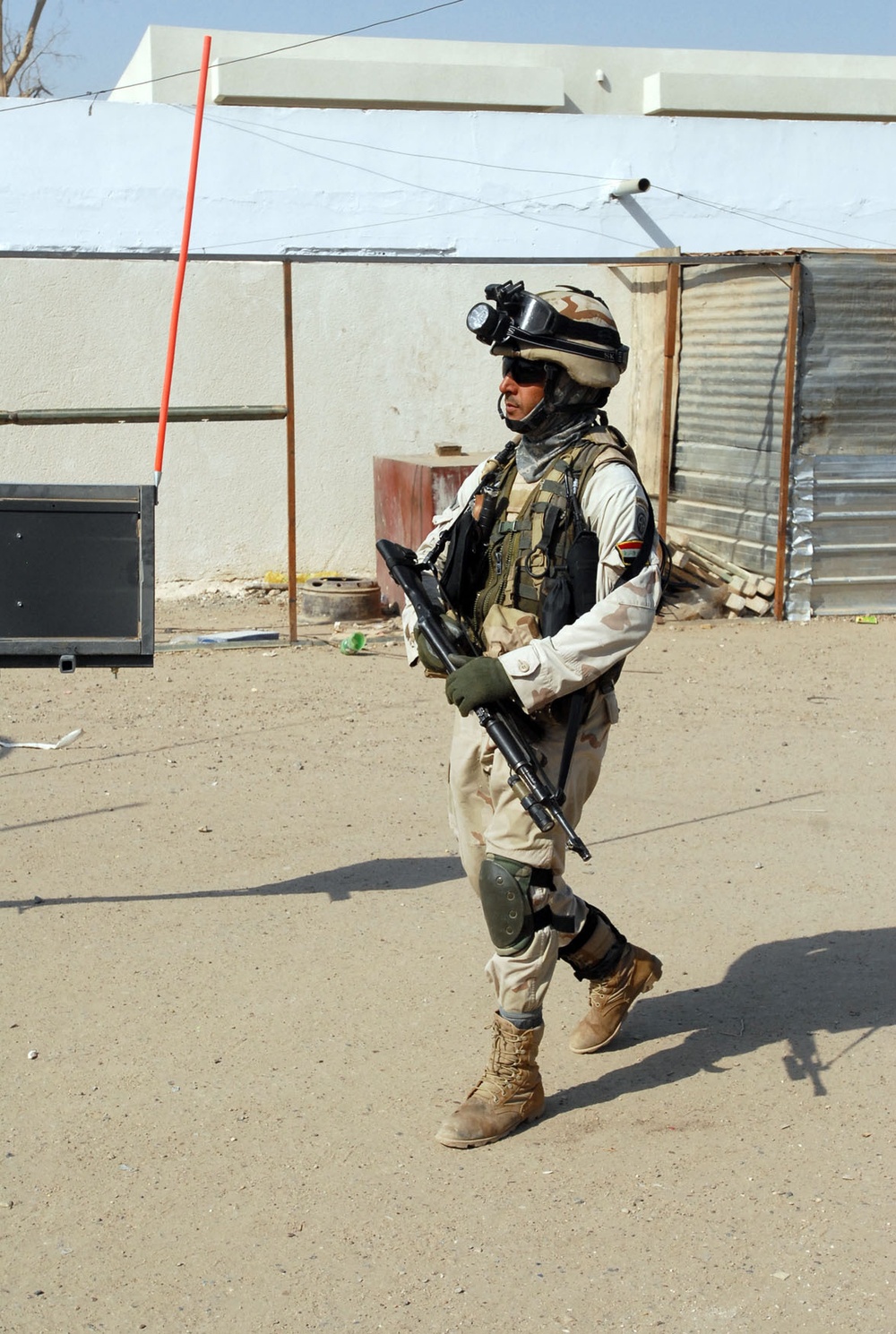 Iraqi Army, Multi-National Division-Baghdad Soldiers provide security during combined medical engagement