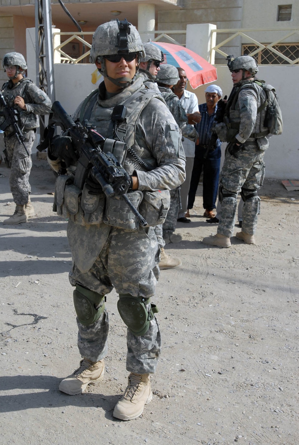 Iraqi Army, Multi-National Division-Baghdad Soldiers provide security during combined medical engagement