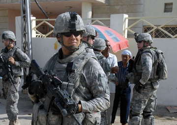 Iraqi Army, Multi-National Division-Baghdad Soldiers provide security during combined medical engagement