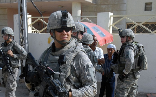 Iraqi Army, Multi-National Division-Baghdad Soldiers provide security during combined medical engagement