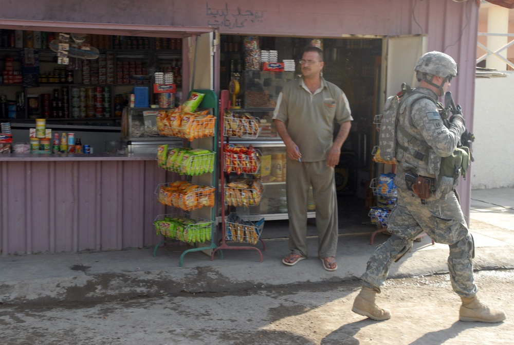 Iraqi Army, Multi-National Division-Baghdad Soldiers provide security during combined medical engagement