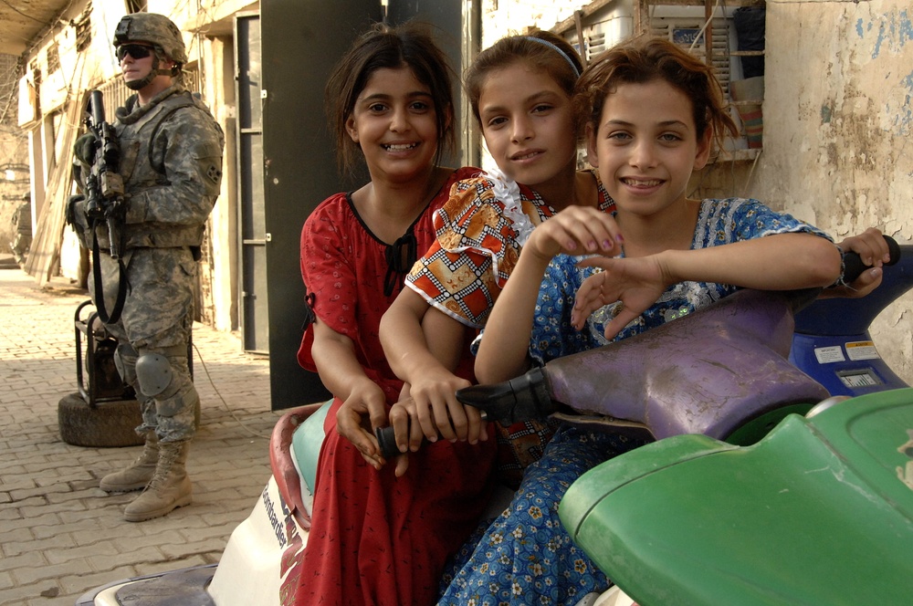 U.S, Iraqi soldiers Patrol Baghdad Neighborhood