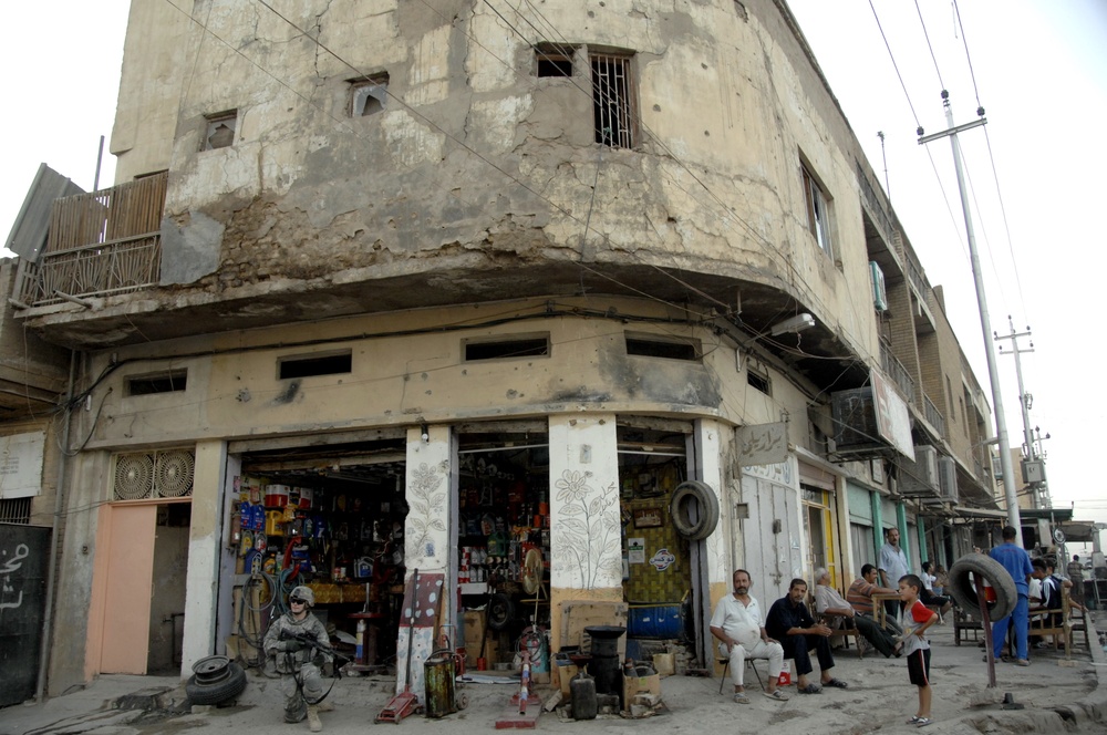 U.S, Iraqi soldiers Patrol Baghdad Neighborhood