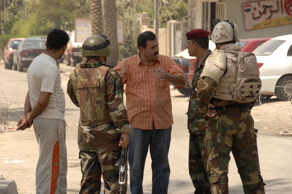 U.S, Iraqi soldiers Patrol Baghdad Neighborhood