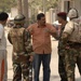 U.S, Iraqi soldiers Patrol Baghdad Neighborhood