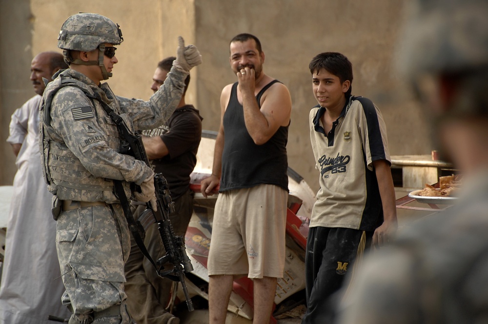 U.S, Iraqi soldiers Patrol Baghdad Neighborhood