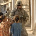 U.S, Iraqi soldiers Patrol Baghdad Neighborhood