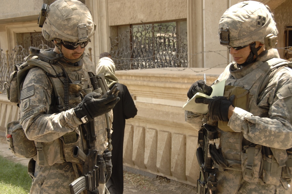 U.S, Iraqi soldiers Patrol Baghdad Neighborhood