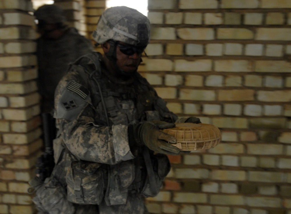 Soldiers from 1st Brigade Combat Team, 4th Infantry Division, discovers munitions cache in Abu T'shir