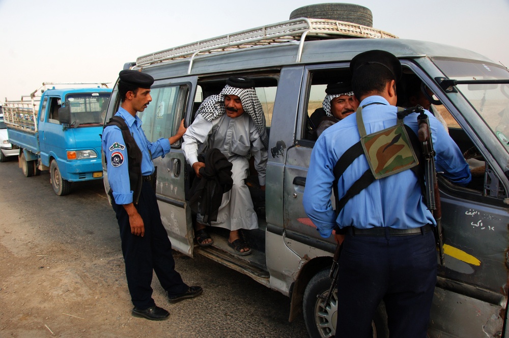 Iraqi Police Conduct Vehicle Search