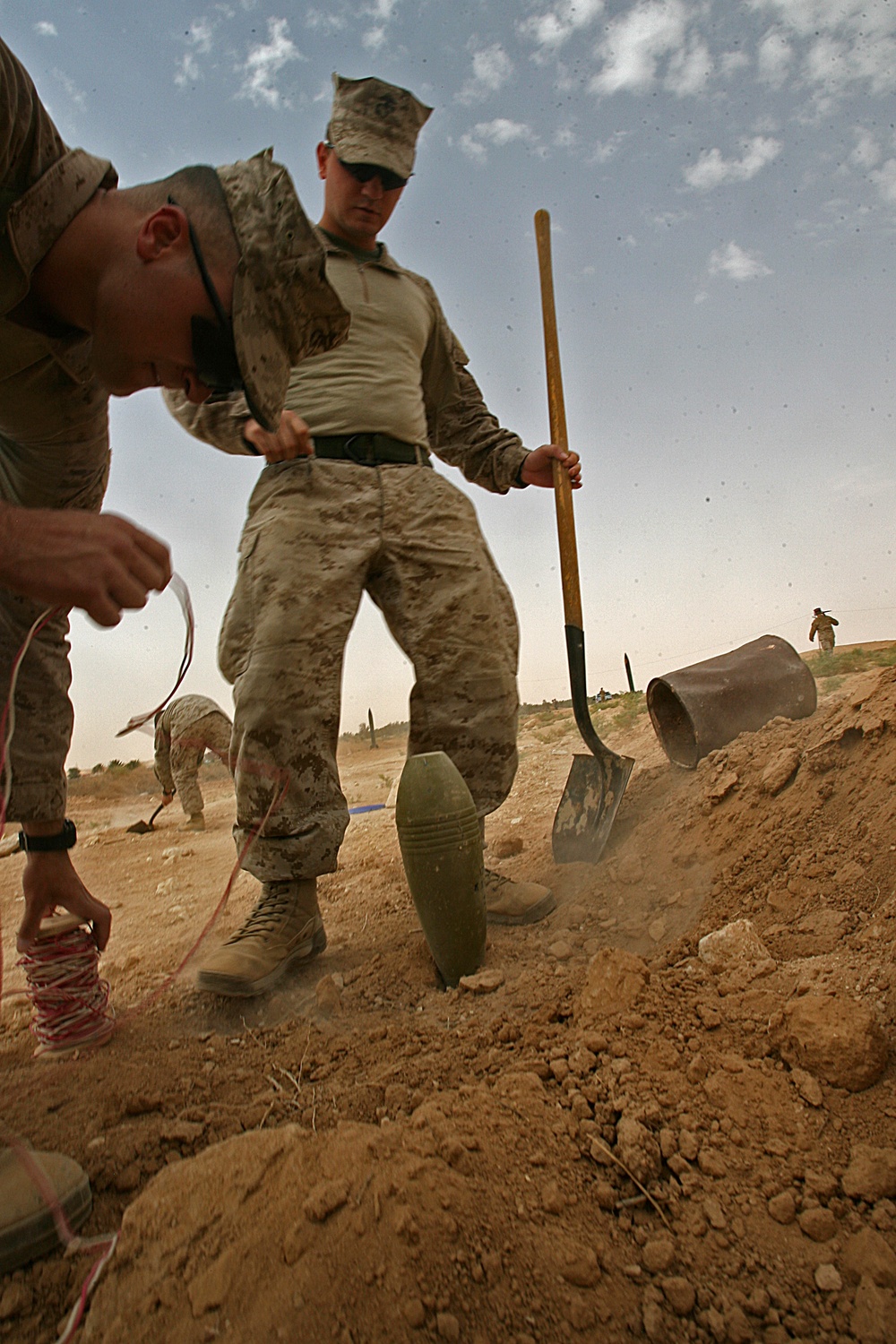 Marines plant mock IEDs for training