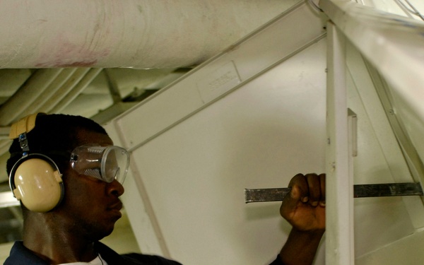 Seaman Aboard USS Blue Ridge Prep for Space Renovation