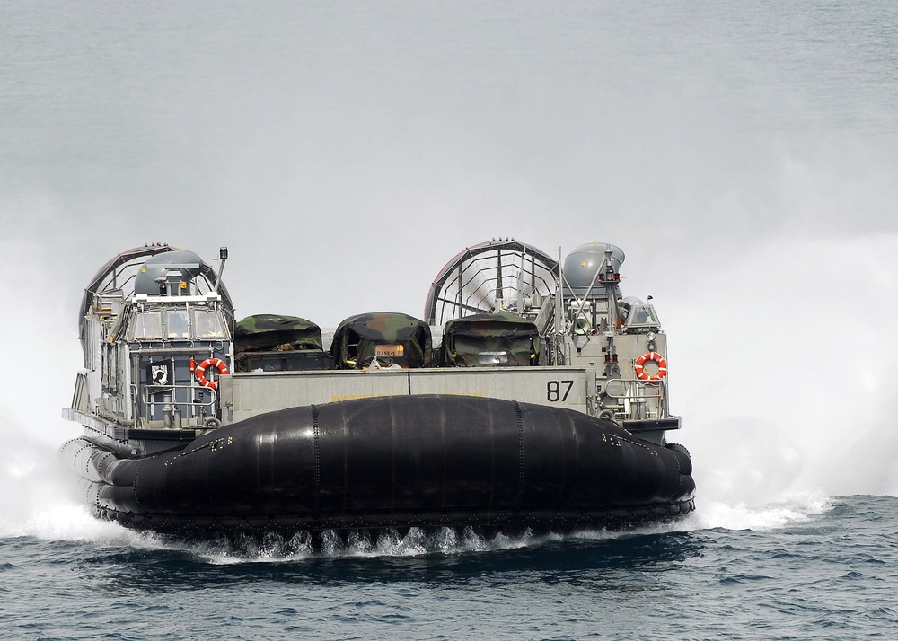Landing craft air cushion approaches USS Iwo Jima