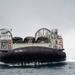 Landing craft air cushion approaches USS Iwo Jima