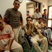 U.S. Soldiers, Iraqi Police Exam Iraqi Civilians
