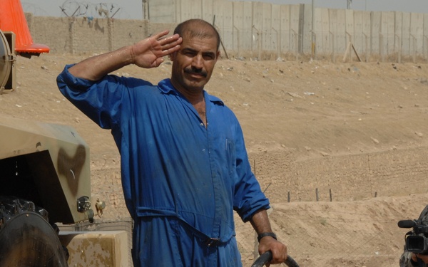 Iraqi soldier salutes camera