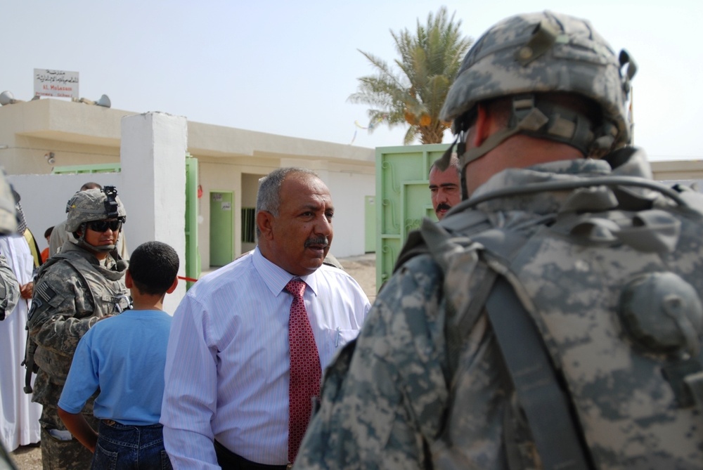 Iraqis, Coalition forces open new school in Baghdad Province
