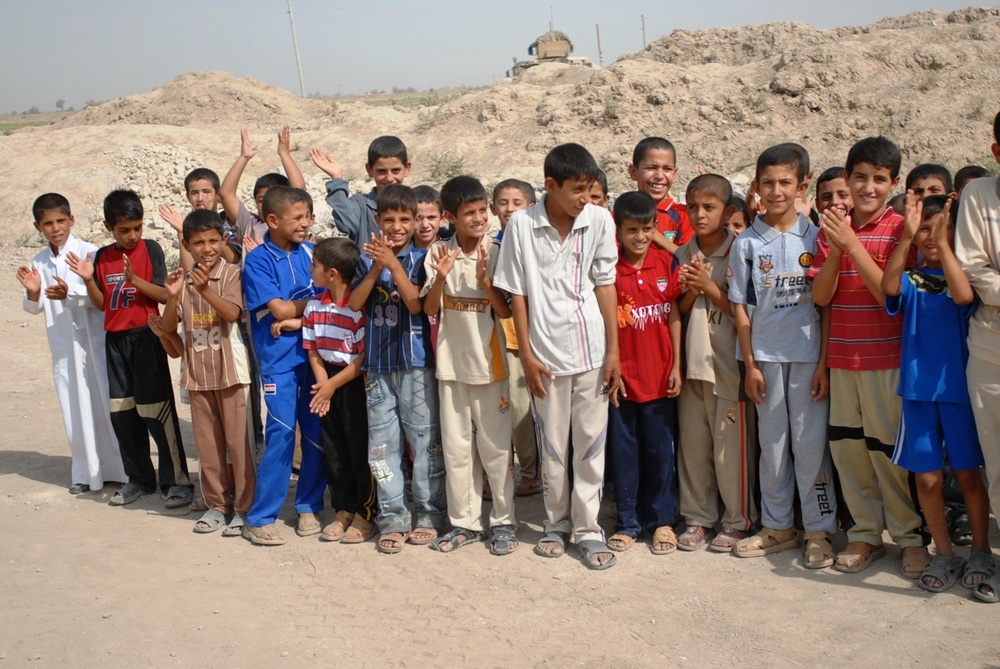 Iraqis, Coalition forces open new school in Baghdad Province