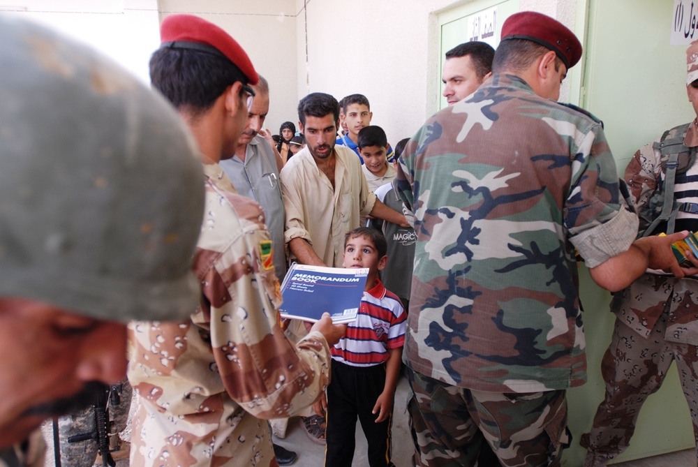 Iraqis, Coalition forces open new school in Baghdad Province