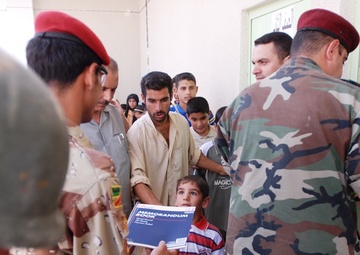Iraqis, Coalition forces open new school in Baghdad Province