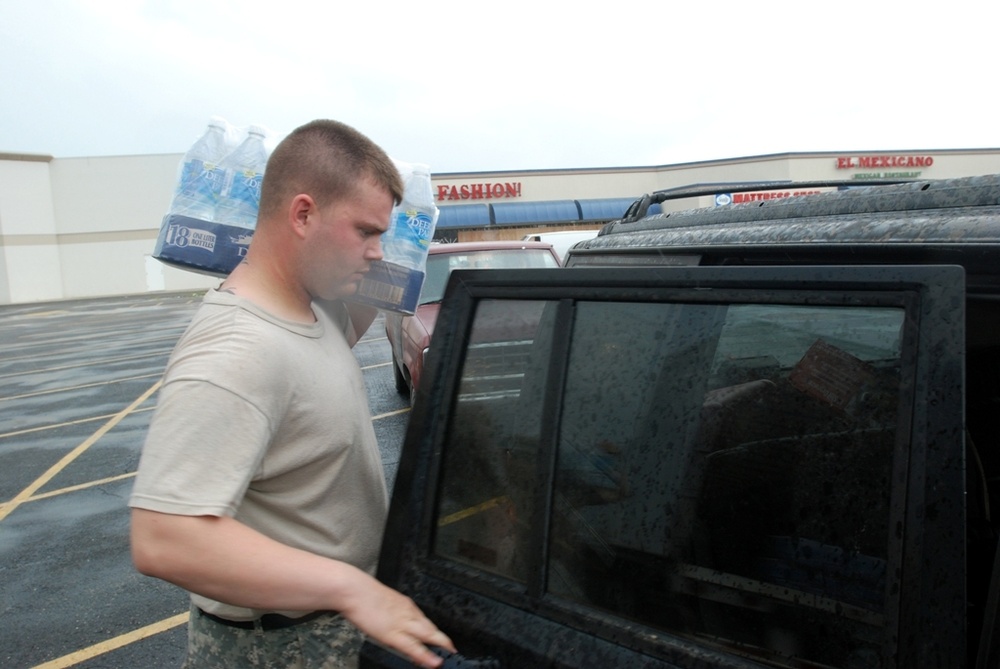 Louisiana National Guardsmen distribute food and water to residents in New Iberia, La.