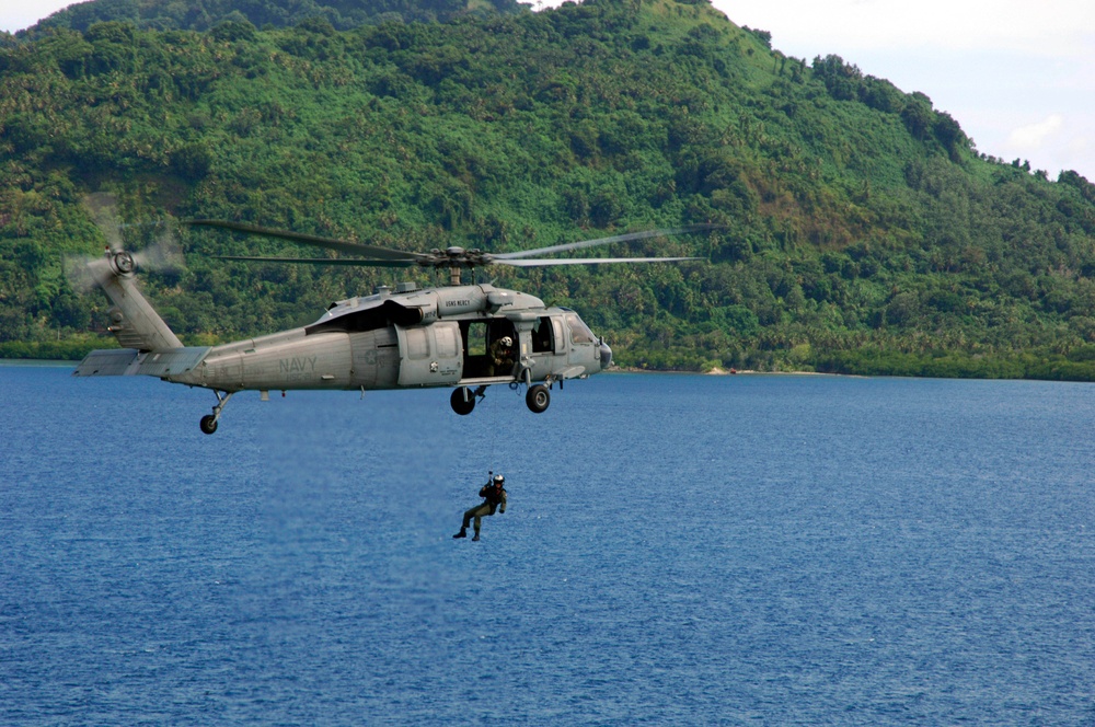 Sailor Flies Over Waters of Micronesia