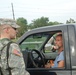 Members of the Louisiana National Guard's 256th Brigade Combat Team control traffic