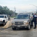 Members of the Louisiana National Guard's 256th Brigade Combat Team control traffic