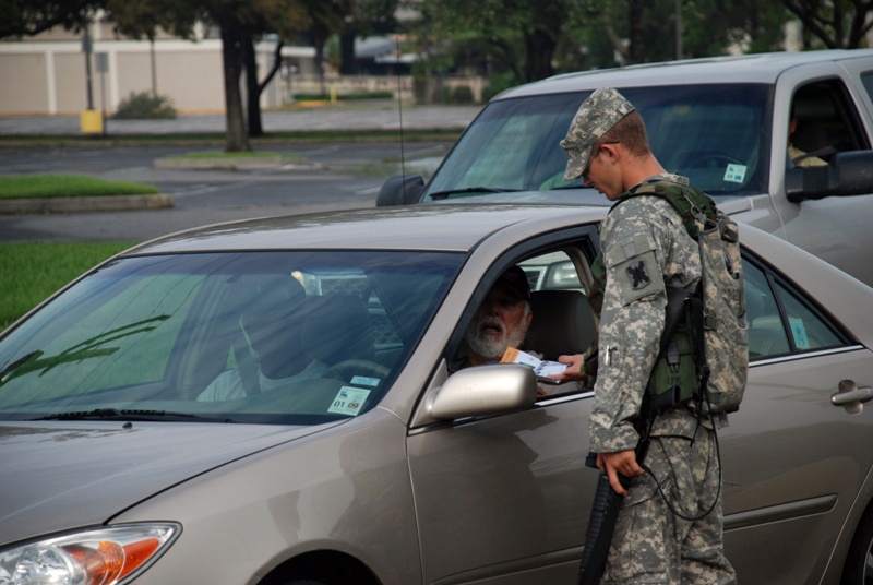 Members of the Louisiana National Guard's 256th Brigade Combat Team control traffic