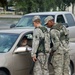 Members of the Louisiana National Guard's 256th Brigade Combat Team control traffic