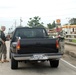 Members of the Louisiana National Guard's 256th Brigade Combat Team control traffic