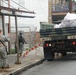 Members of the Louisiana National Guard's 256th Brigade Combat Team Distribute Supplies