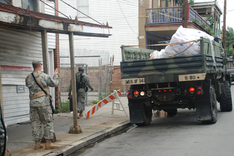 Members of the Louisiana National Guard's 256th Brigade Combat Team Distribute Supplies