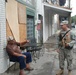 Members of the Louisiana National Guard's 256th Brigade Combat Team Distribute Supplies