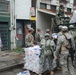 Members of the Louisiana National Guard's 256th Brigade Combat Team Distribute Supplies