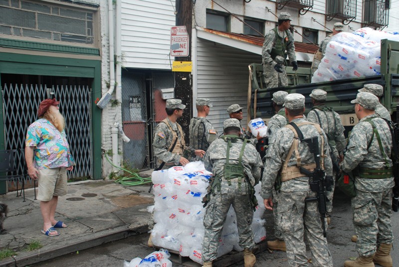 Members of the Louisiana National Guard's 256th Brigade Combat Team Distribute Supplies