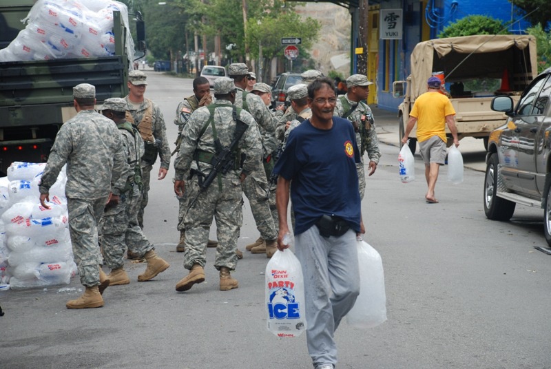 Members of the Louisiana National Guard's 256th Brigade Combat Team Distribute Supplies