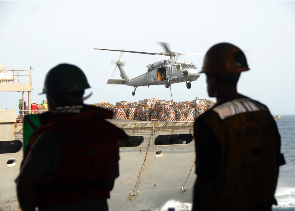 Pallets of supplies coming in to the USS Abraham Lincoln