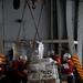 Pallets of supplies coming in to the USS Abraham Lincoln