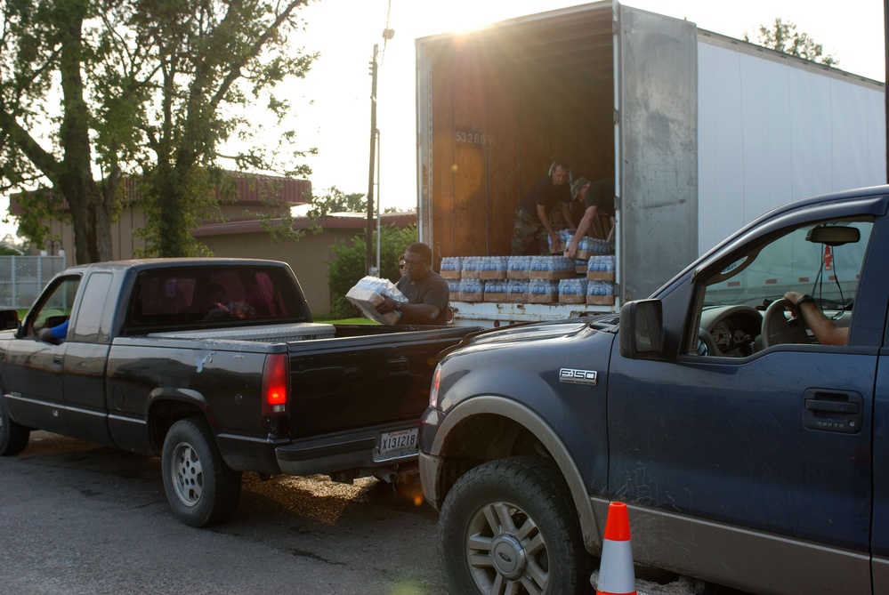 Louisiana Air National Guardsmen of the 159th Air Maintenance pass out supplies in Jeanerette, La