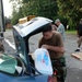 Louisiana Air National Guardsmen of the 159th Air Maintenance pass out supplies in Jeanerette, La