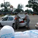 Louisiana National Guardsmen hand out supplies to residents in New Iberia, La.