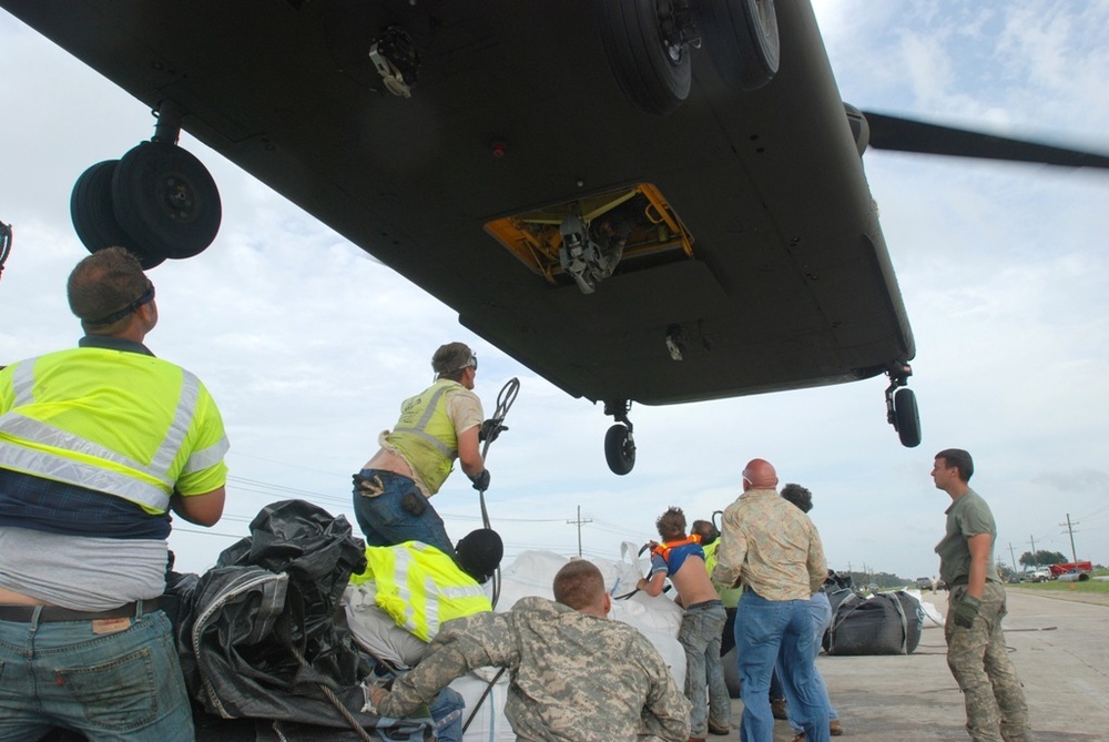 Army, Air National Guard teams with local citizens to stem breached levee
