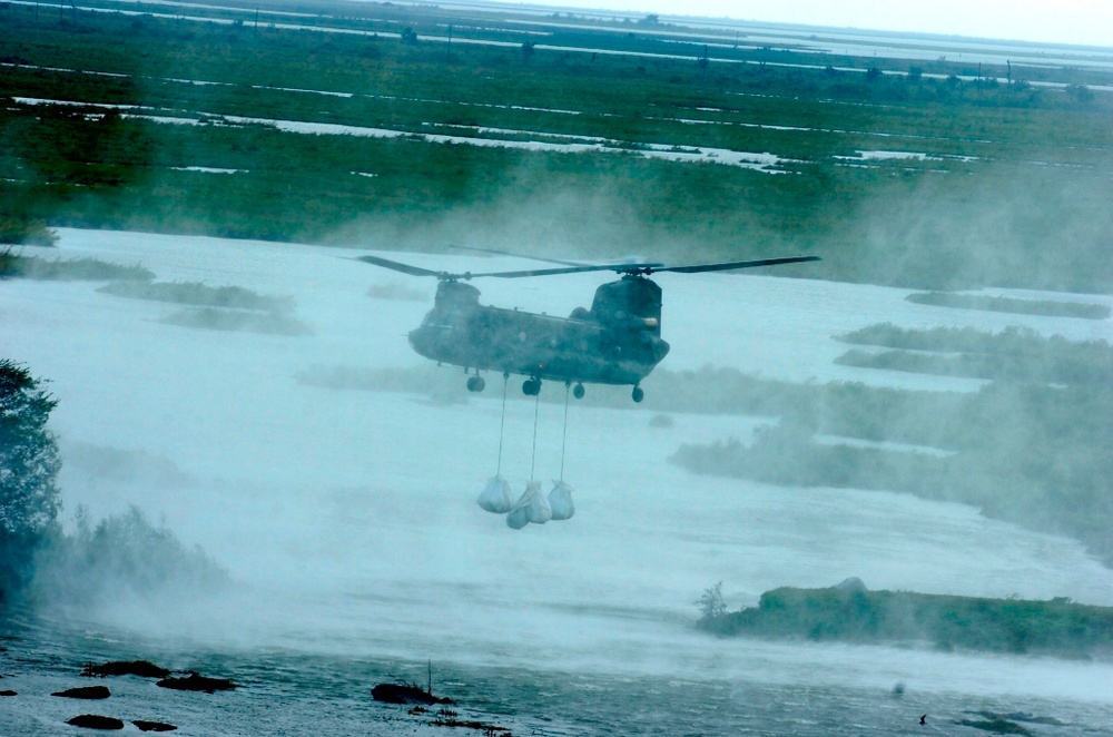 Army, Air National Guard teams with local citizens to stem breached levee